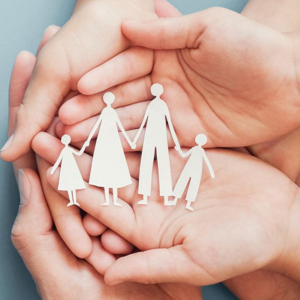 Smiling professional holding a tablet, representing TinyEYE's online therapy services for schools and therapists.